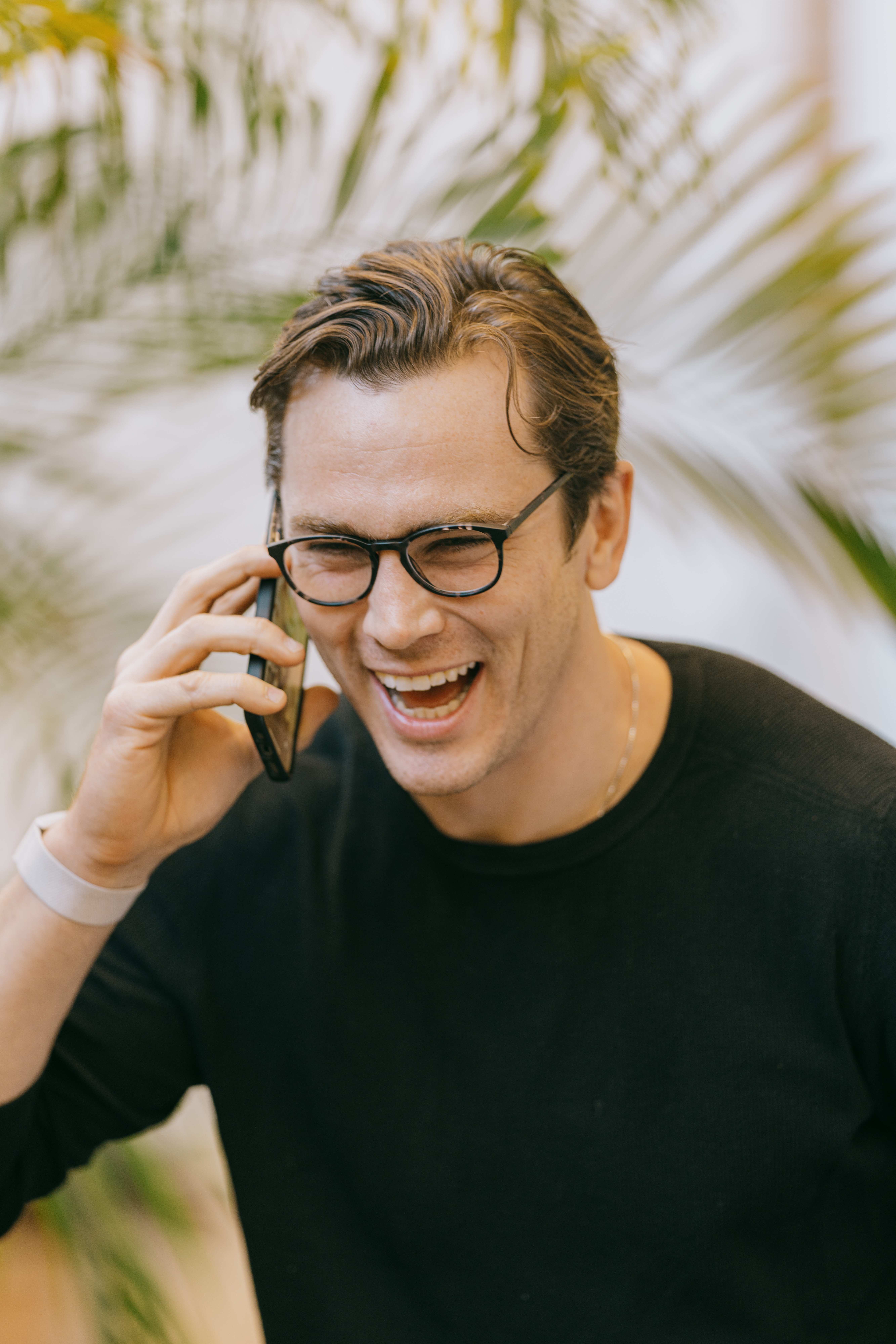 Image of Derek on phone smiling