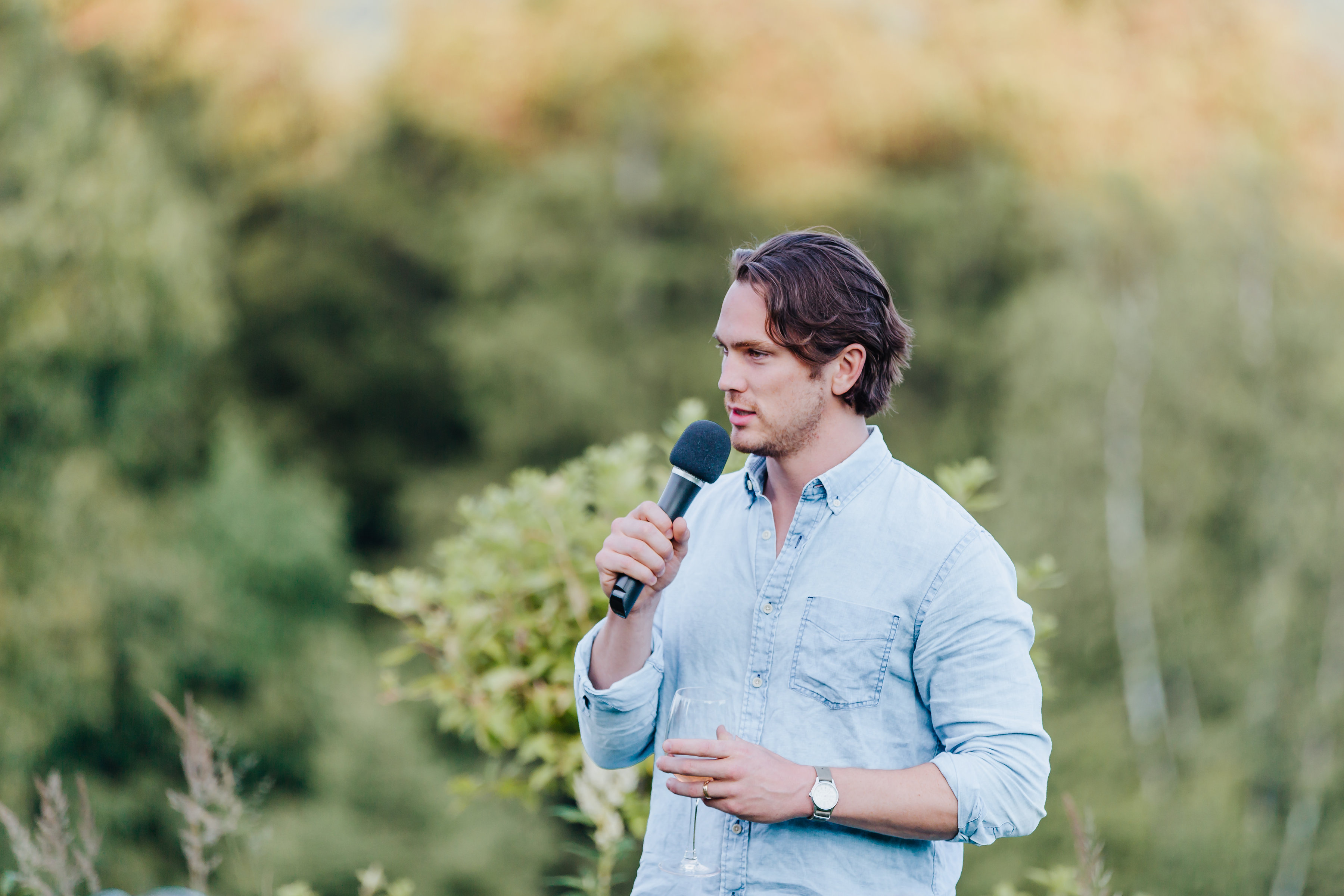 Derek speaking at an outdoor workshop event